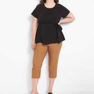 Fitted black short sleeve top with tie belt